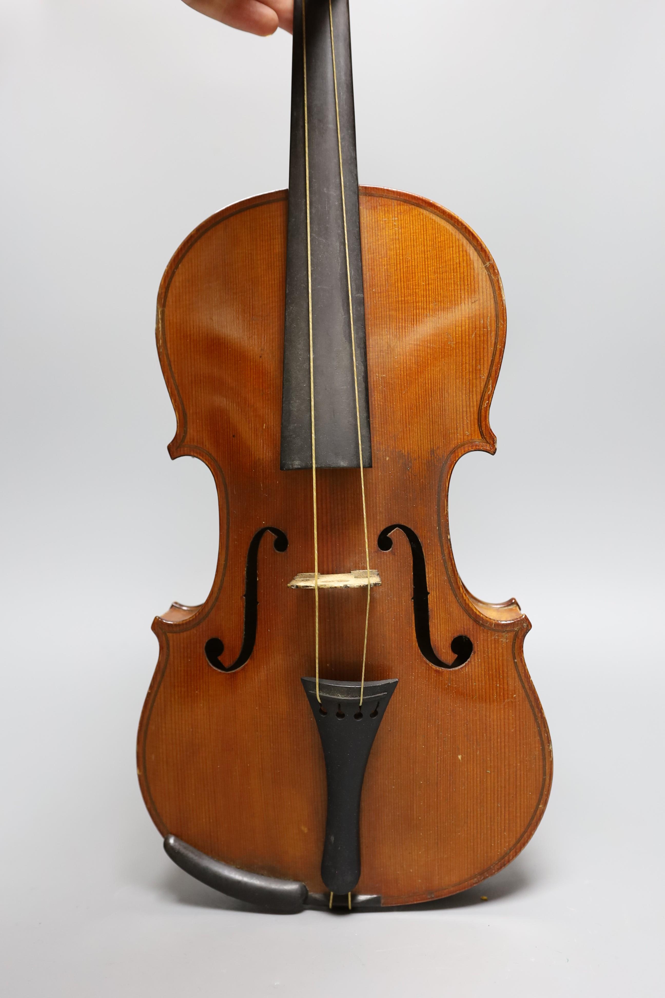No labe and it is a full sized one.An early 20th century cased violin, length of back 36 cm